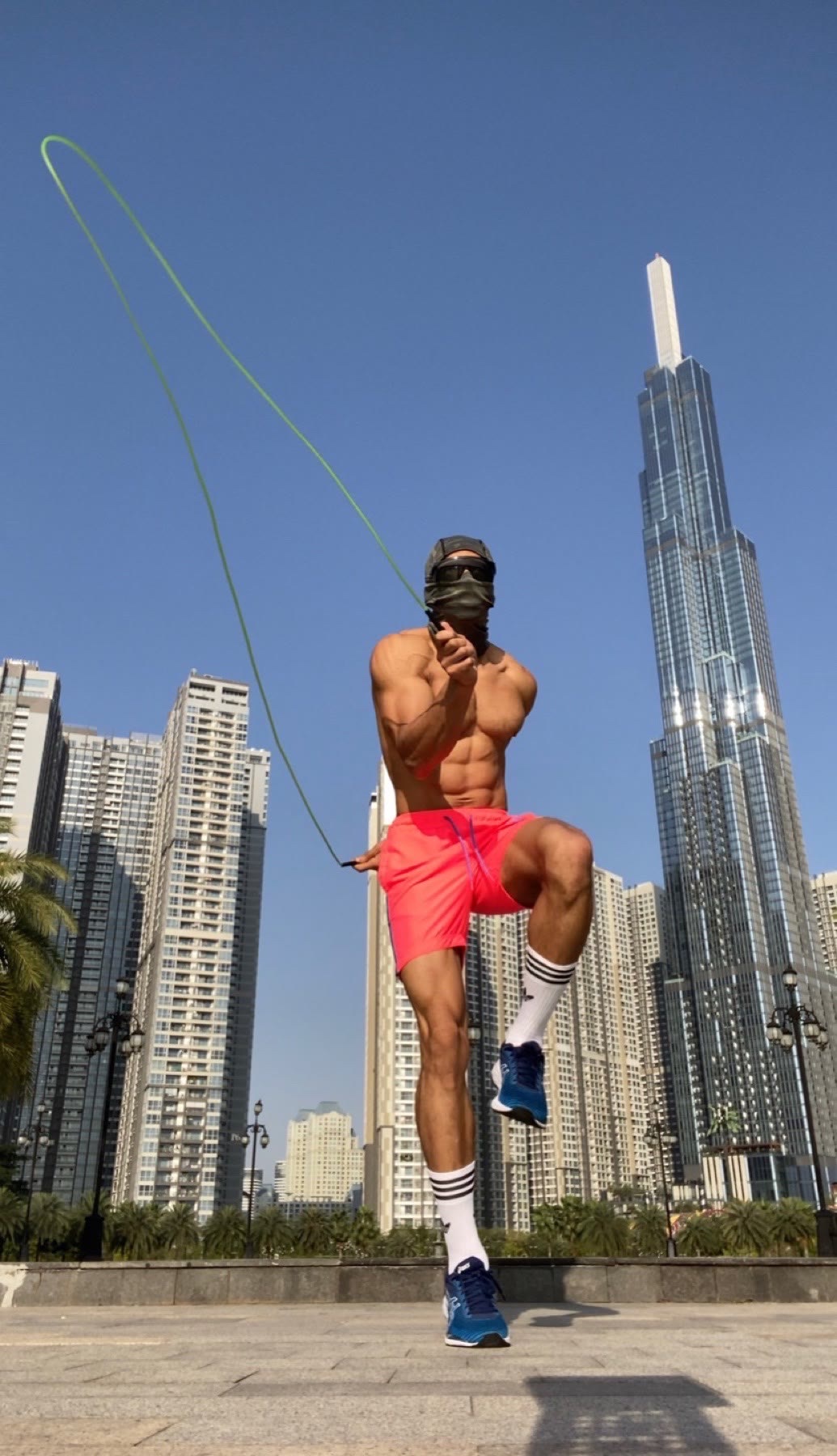 OYOTTA jumping rope against a city skyline